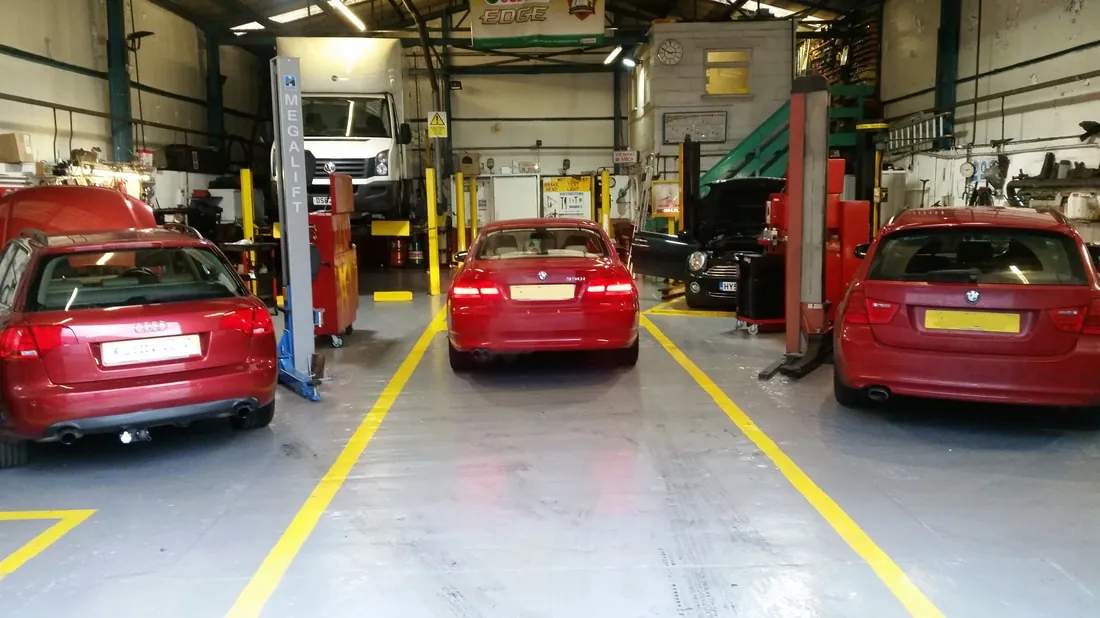 Vehicles in the G and J Starkey servicing workshop